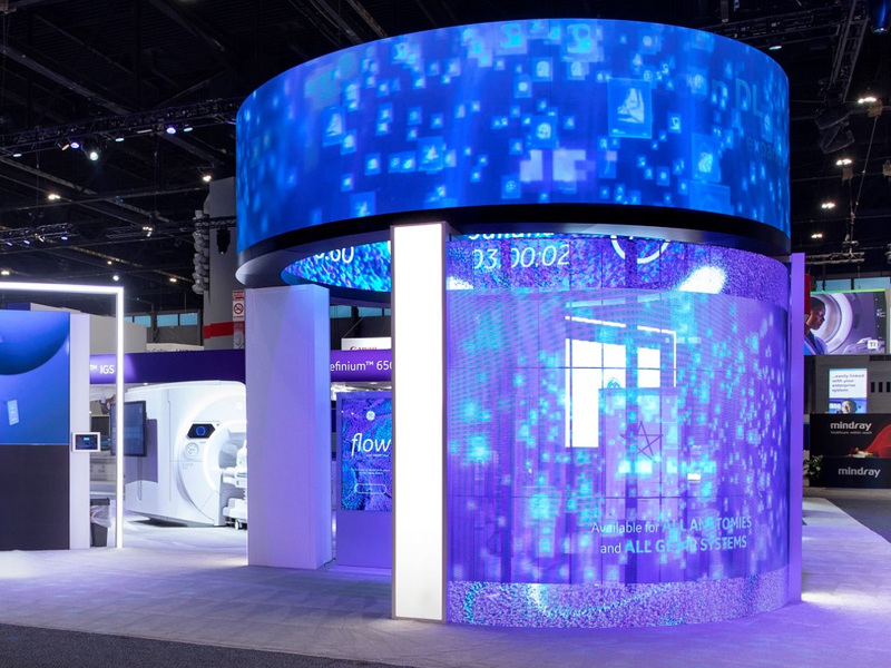 a circular LED structure on a trade show floor