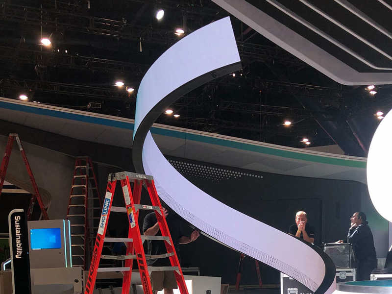 large LED helix structure next to a red ladder